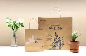 신한투자증권, 친환경 재생지 쇼핑백 도입